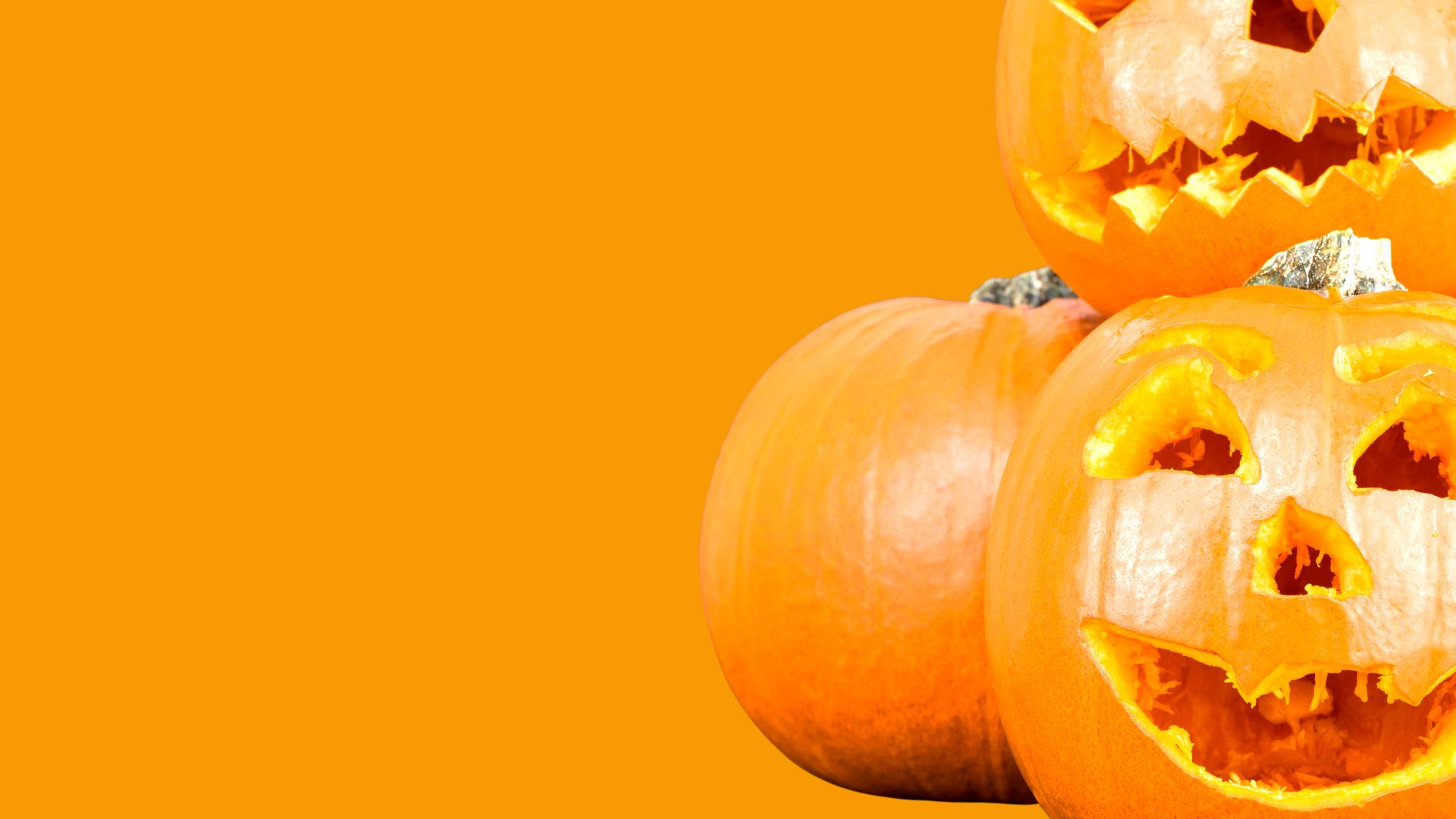 Carve a Pumpkin. Orange background. Photo of Carved Pumpkins.
